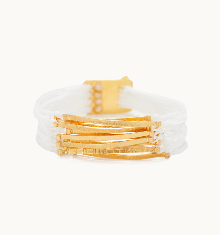 white multi line bracelet